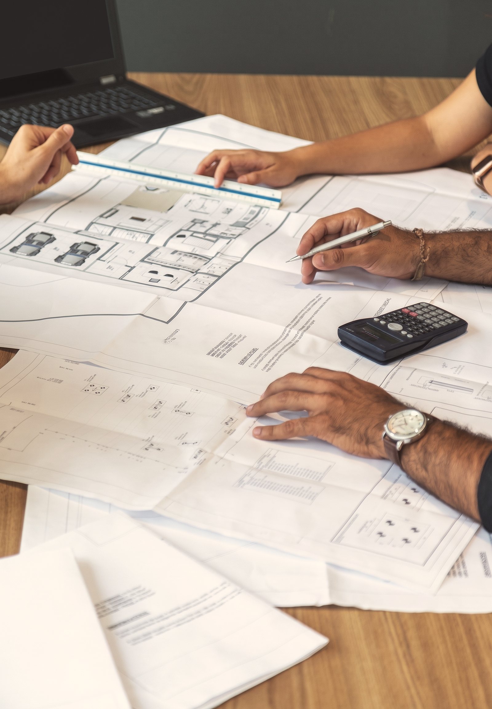 Reviewing plans on a desk